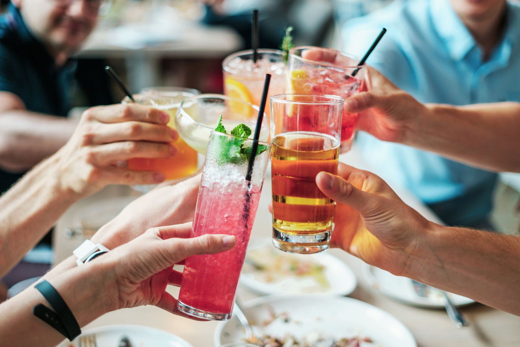 Group toasting cocktails celebrating