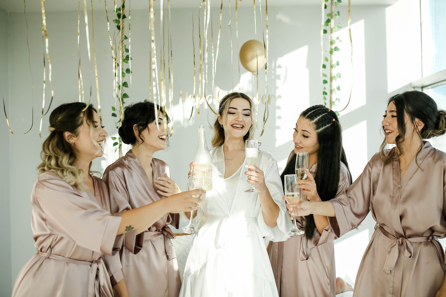 Hen party women celebrating champagne